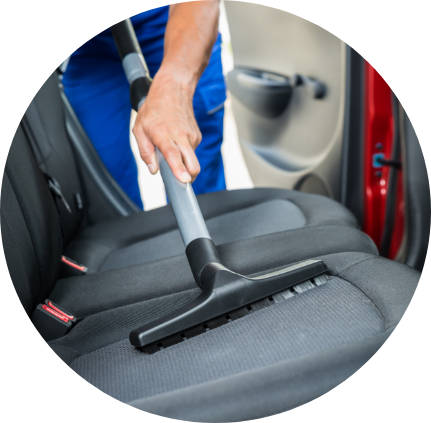 super sudz car wash man vacuuming car seats