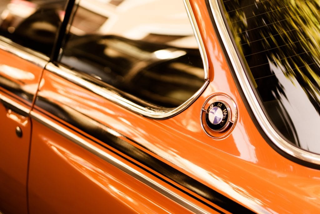 orange car with dark tinted windows